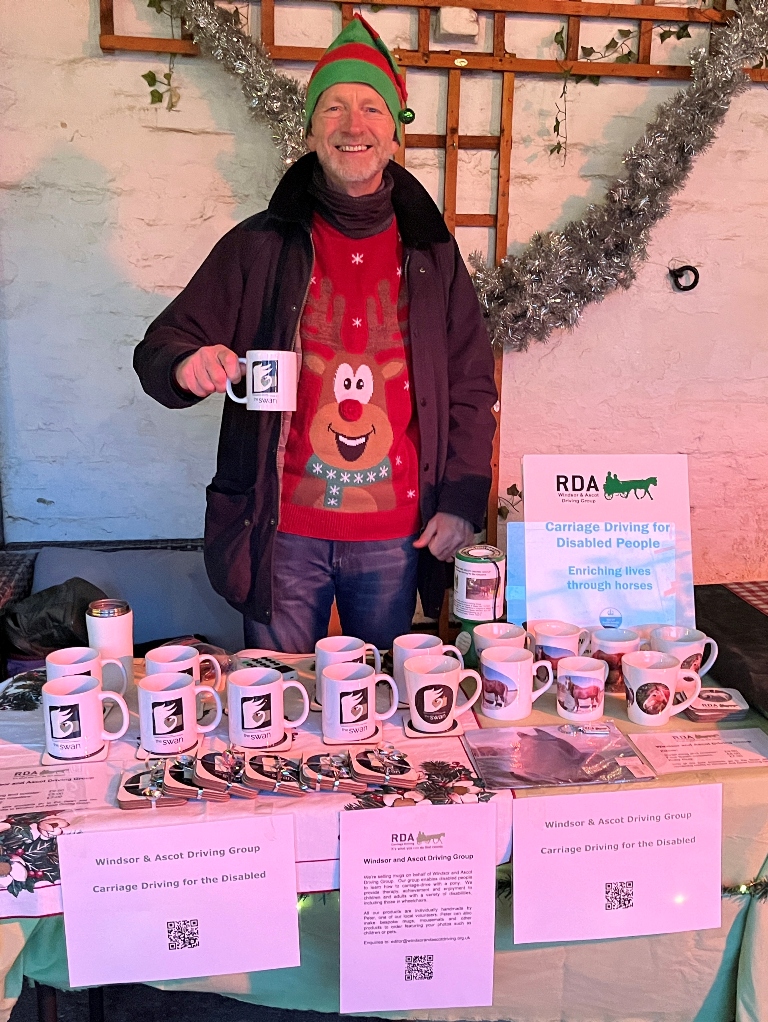 Colin raising funds by selling mugs at the pub